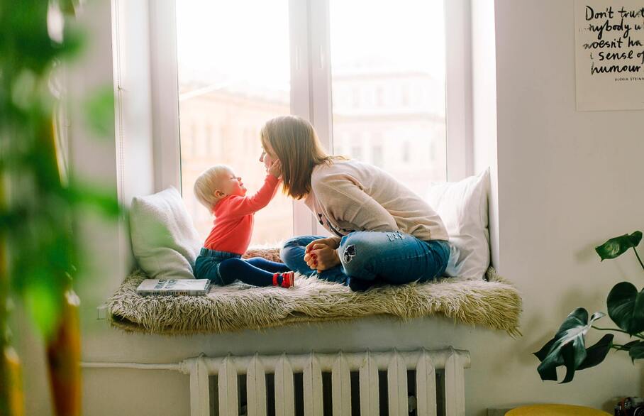 Parent leaning into a child