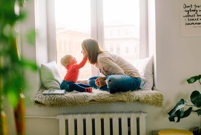 Parent leaning into a child