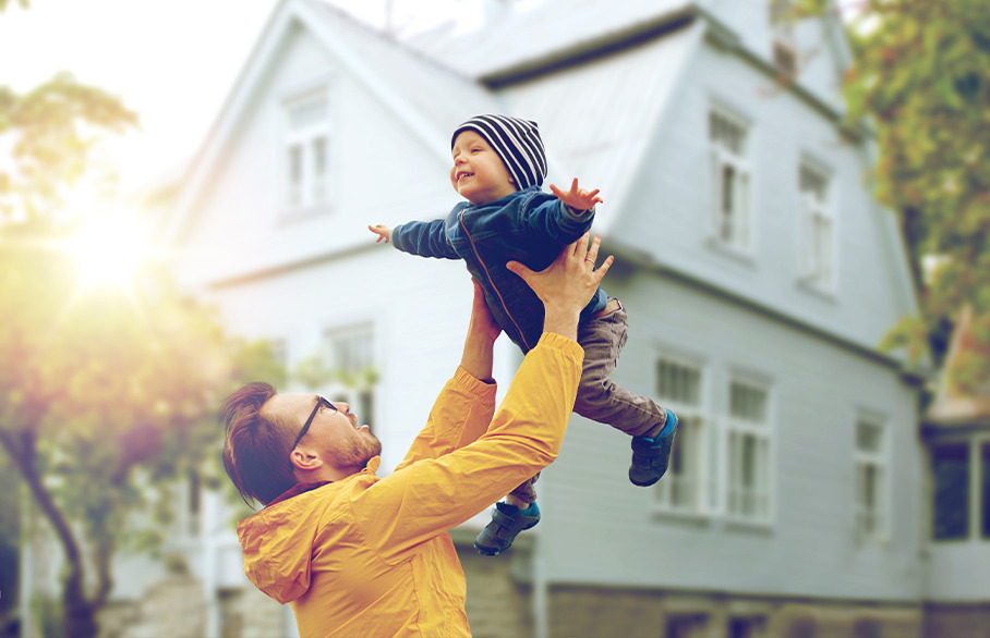 Father holding son up