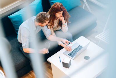 Couple looking at a laptop