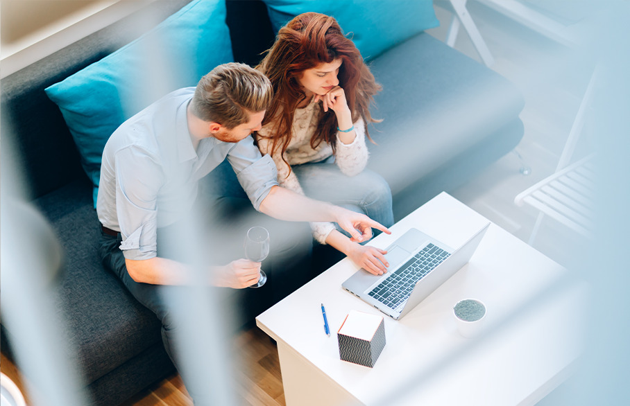 Couple using laptop