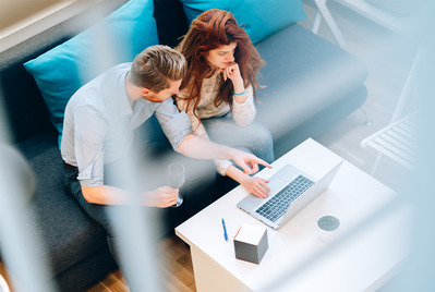 Couple using laptop