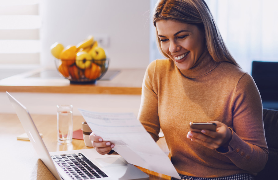 Woman looking happily at her phone