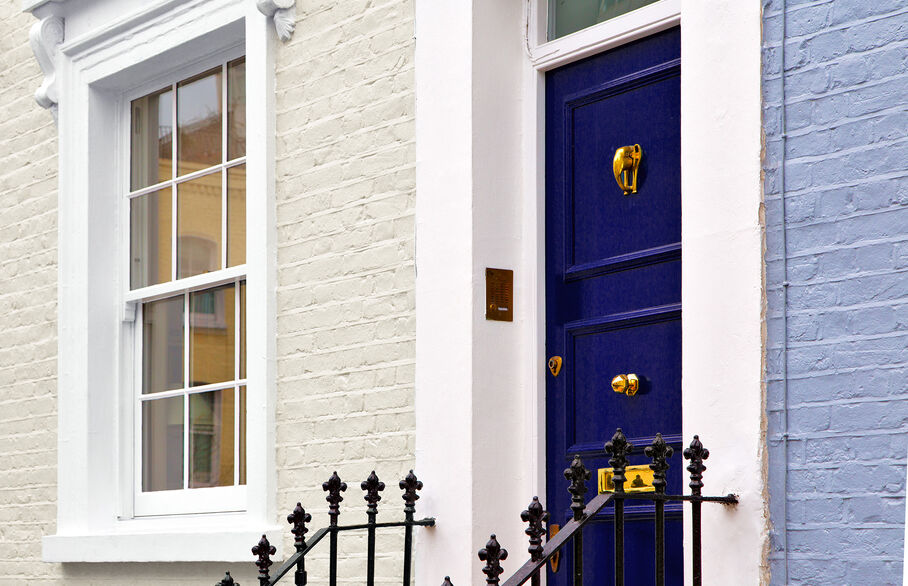 House with blue door and steps leading to it