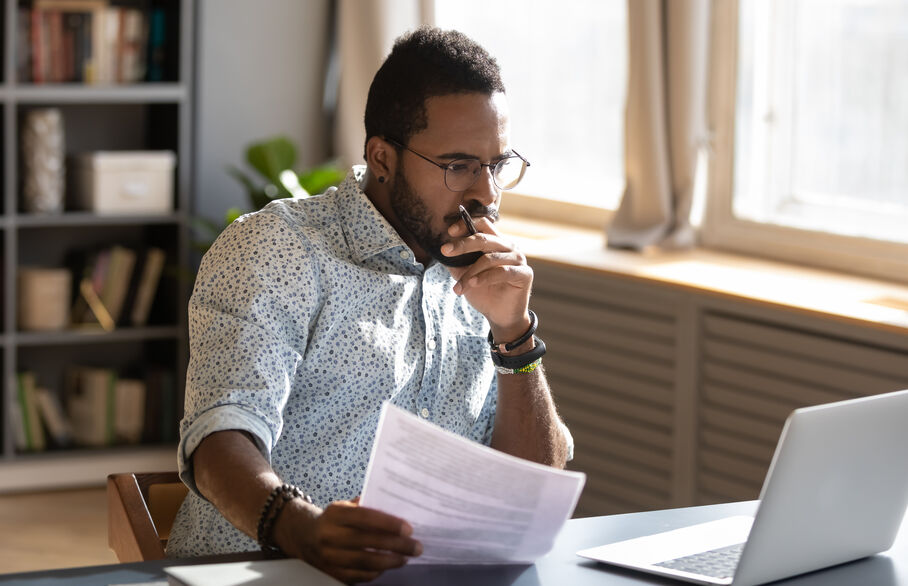 man looking at paper work