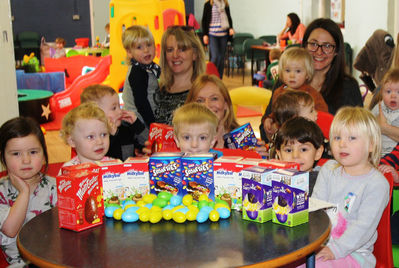 Children and parents at Portishead's youth and community centre, with Easter Eggs donated by Reeds Rains