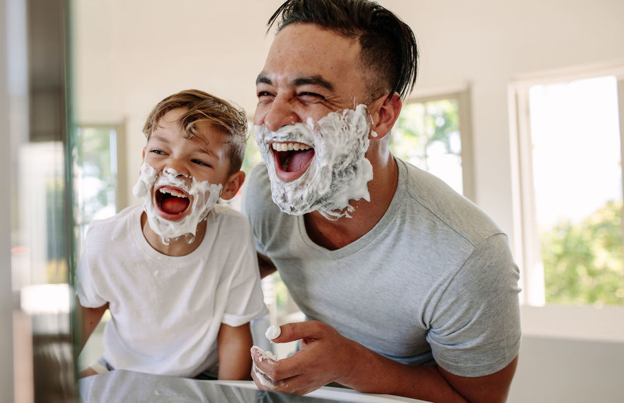 Father and son having fun while shaving