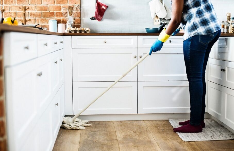 Person cleaning kitchen