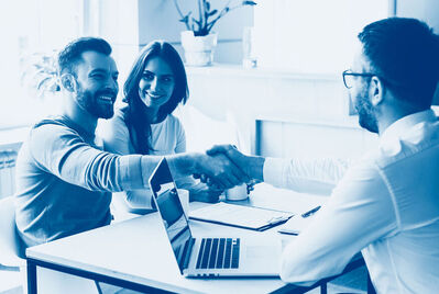 Couple being sat at a desk with an adviser