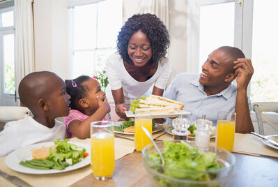 Family sat at the kitchen table