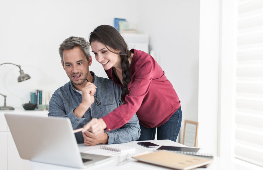 Couple looking at a laptop