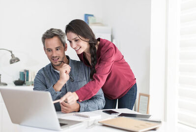 Couple looking at a laptop