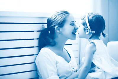 Mum touching noses with little girl