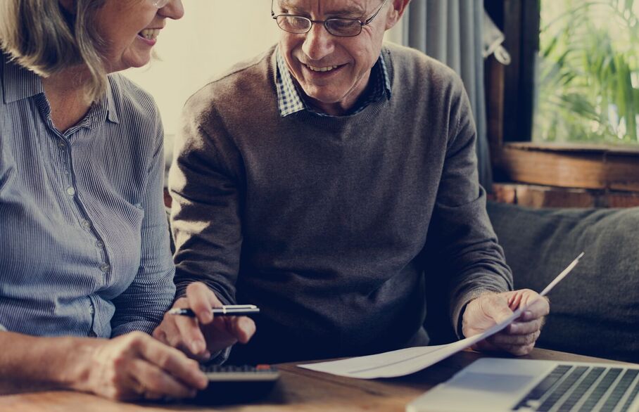 Couple looking at a laptop