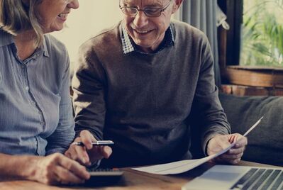 Couple looking at a laptop