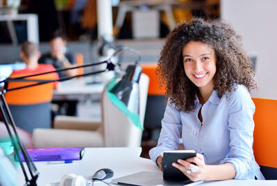 Lady looking at the camera from an office environment