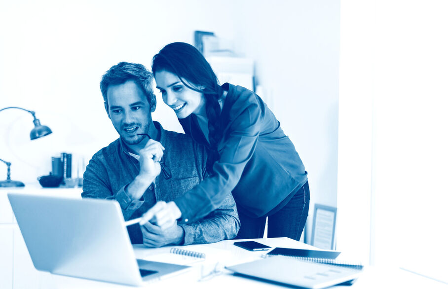 Couple looking at their laptop