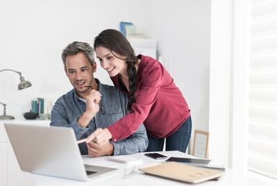 Couple looking at a laptop