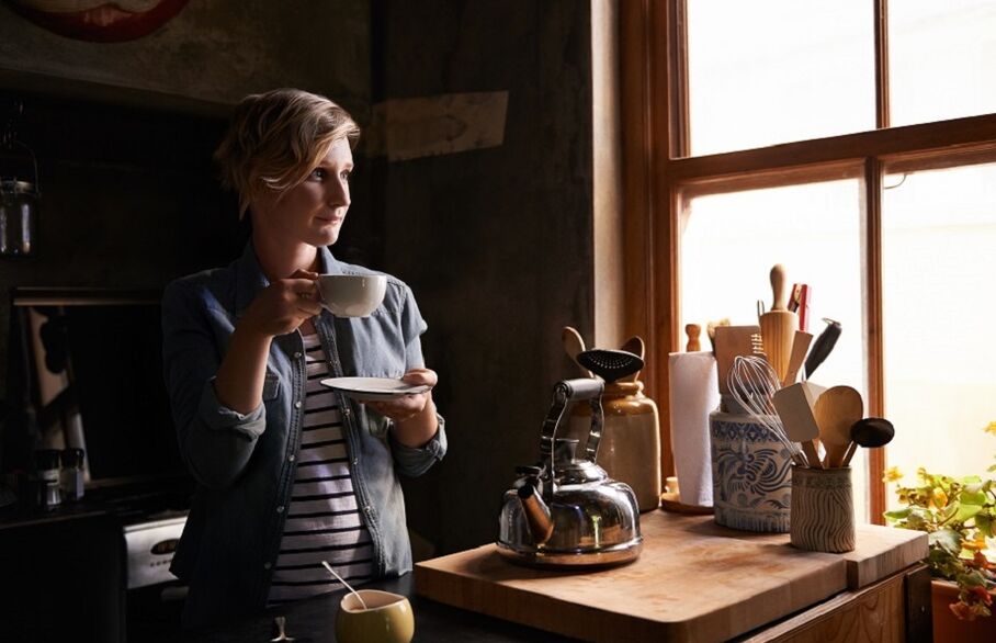 Woman looking out of a window