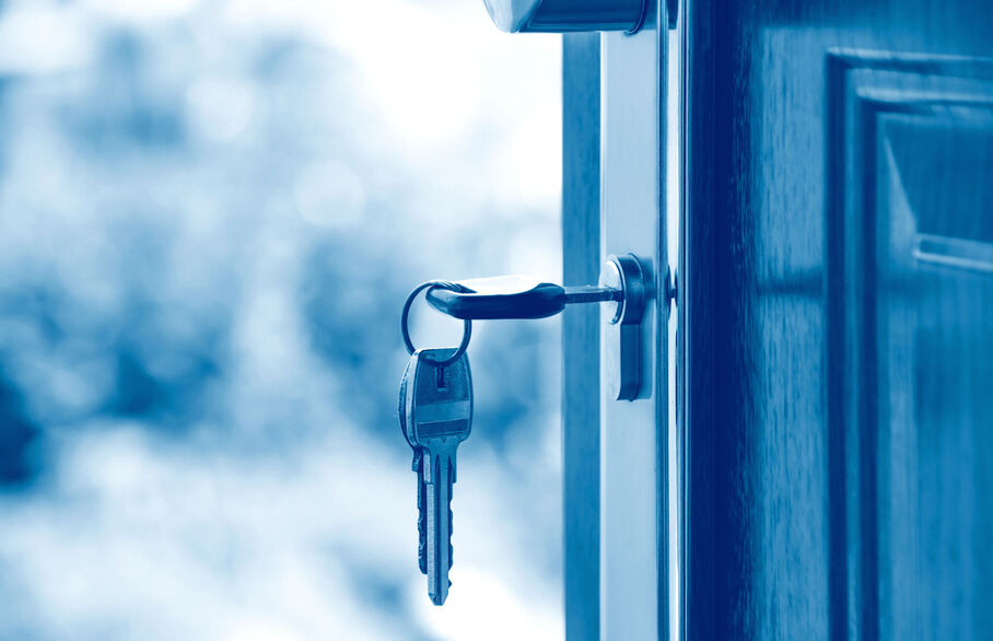 Keys in the lock of an open door