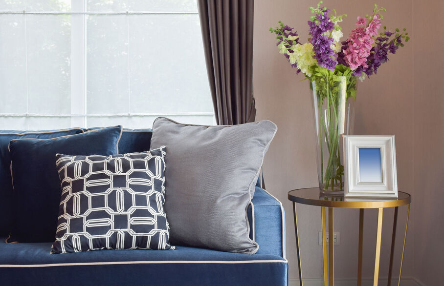 Interior shot of a living room with blue sofa