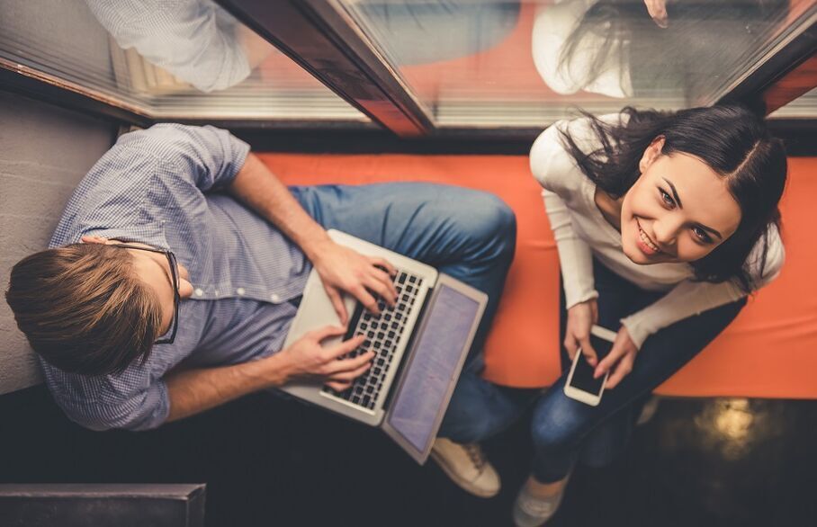 Couple on mobile and laptop