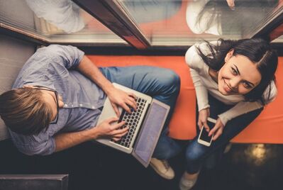 Couple on mobile and laptop