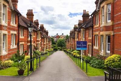 Two rows of houses opposite a path