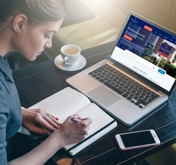 A toy house money bank with British pound notes underneath