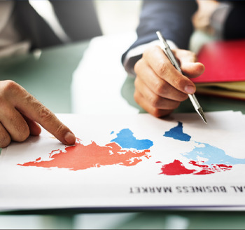 Two people discussing and pointing at a map